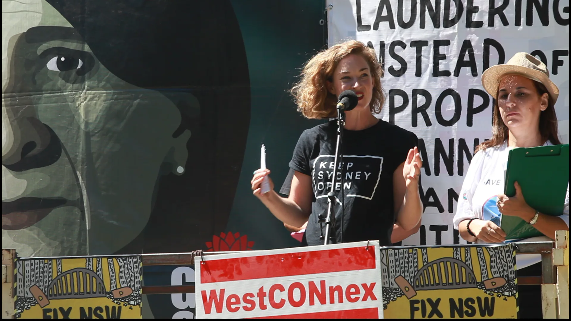 Jess Miller speaking at a community rally
